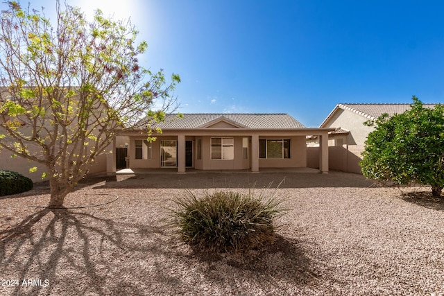 back of property with a patio area