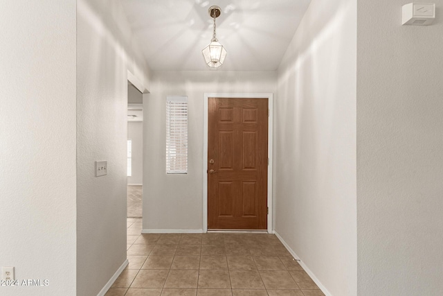 hallway with light tile patterned floors