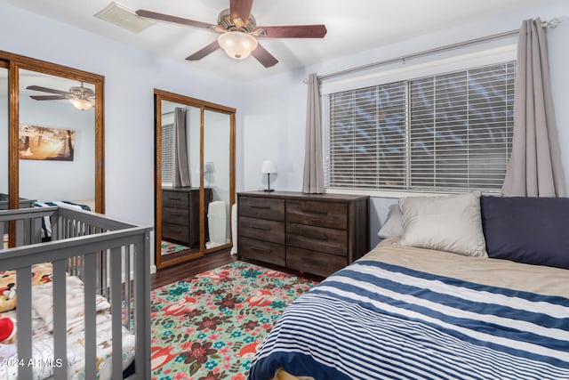 bedroom featuring a closet, wood-type flooring, and ceiling fan