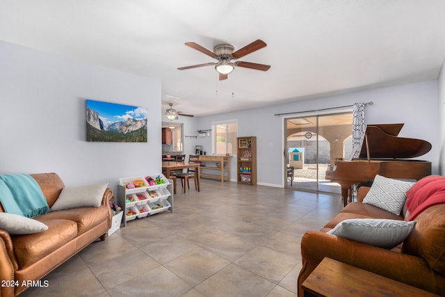 living room with light tile patterned floors and ceiling fan