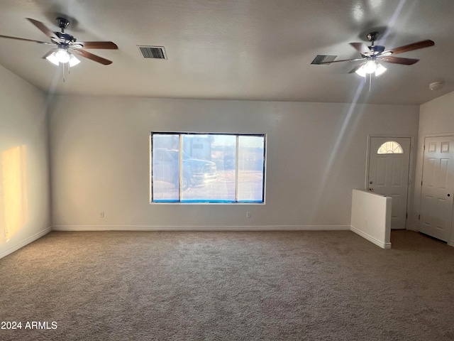 unfurnished living room with carpet flooring, lofted ceiling, and ceiling fan