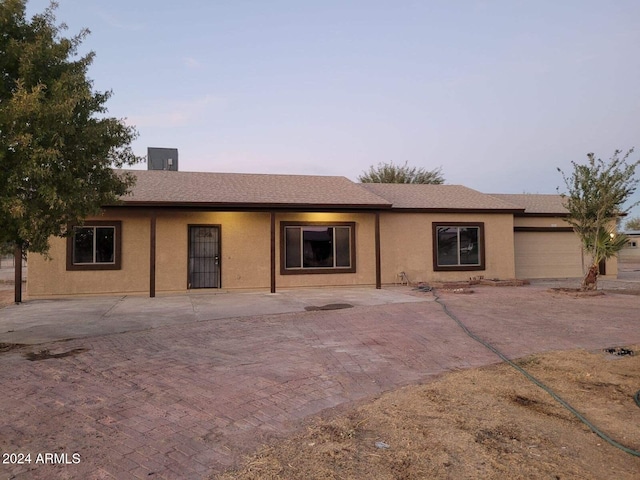 ranch-style home with a garage