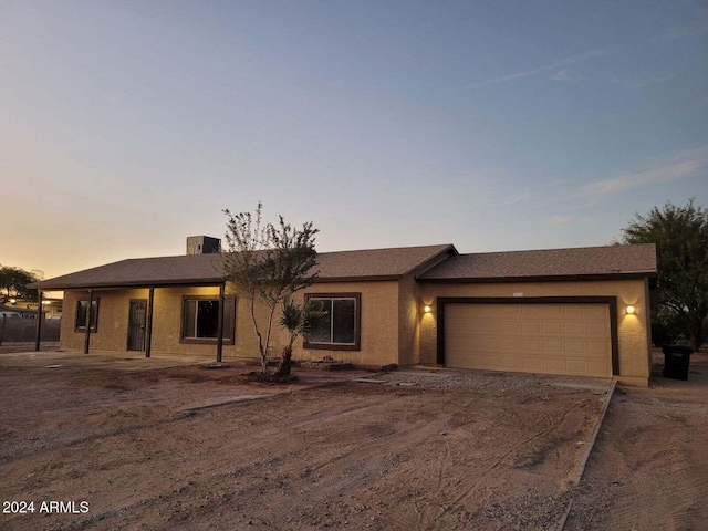 ranch-style home with a garage