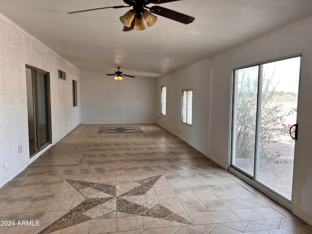 unfurnished room with ceiling fan