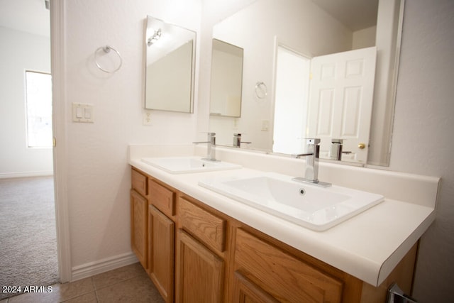 bathroom featuring tile patterned flooring and vanity