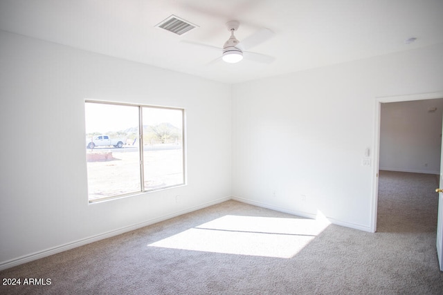 carpeted empty room with ceiling fan