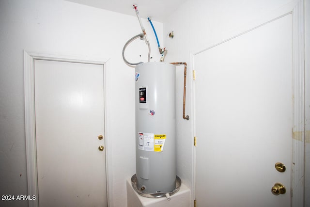 utility room with electric water heater