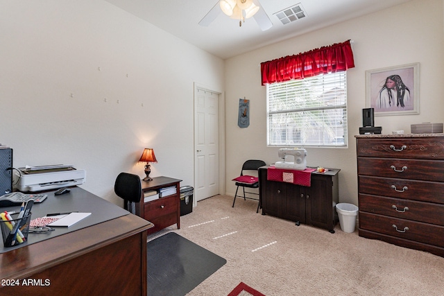 carpeted office featuring ceiling fan