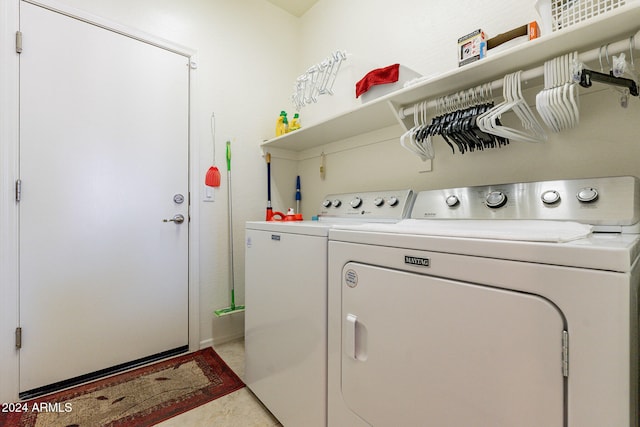 laundry area with washing machine and clothes dryer