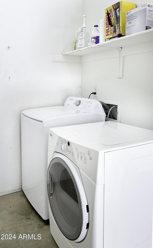 laundry room featuring independent washer and dryer and laundry area