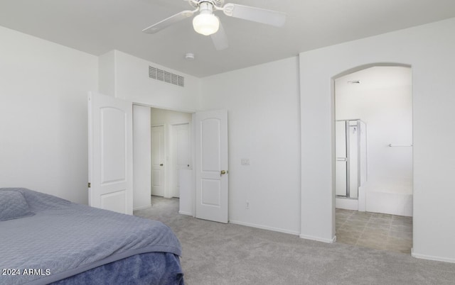 bedroom featuring visible vents, carpet, arched walkways, and ceiling fan