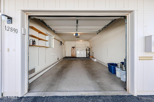 garage with independent washer and dryer, visible vents, water heater, and a garage door opener