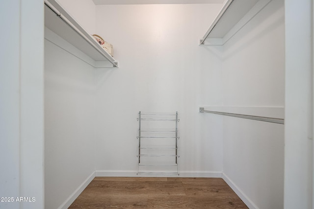 spacious closet with wood finished floors