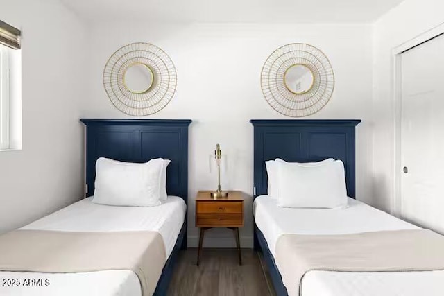 bedroom featuring dark hardwood / wood-style flooring