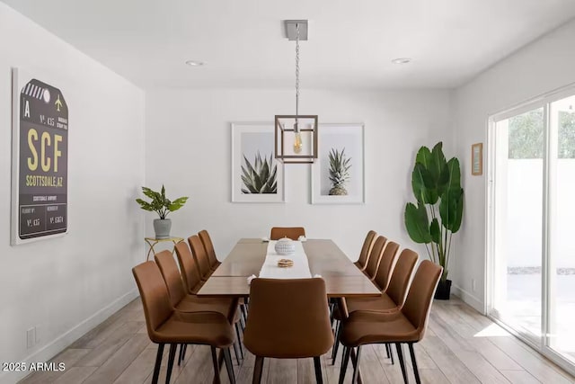 dining area featuring light wood-type flooring