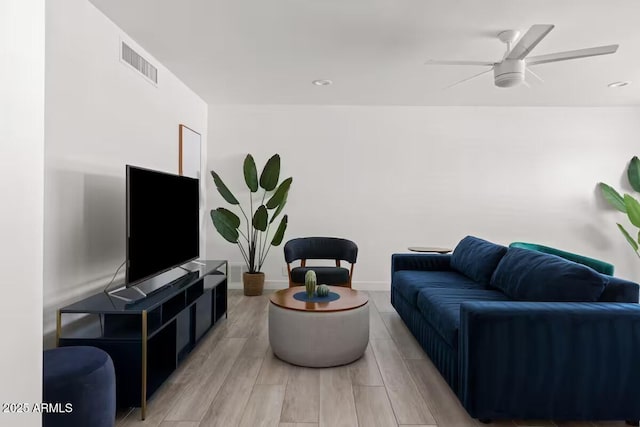 living room featuring ceiling fan