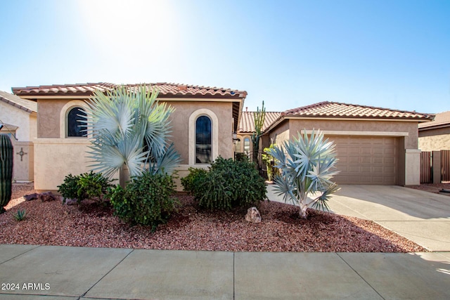 mediterranean / spanish-style house featuring a garage