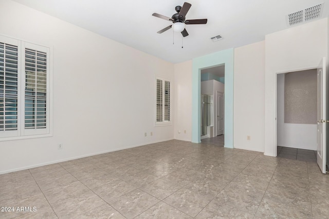 empty room featuring ceiling fan