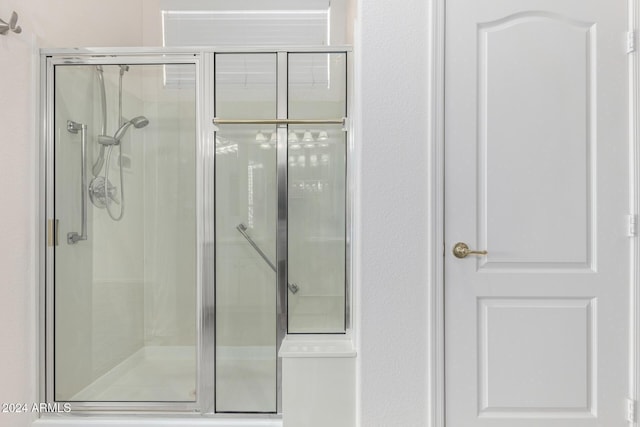 bathroom featuring an enclosed shower