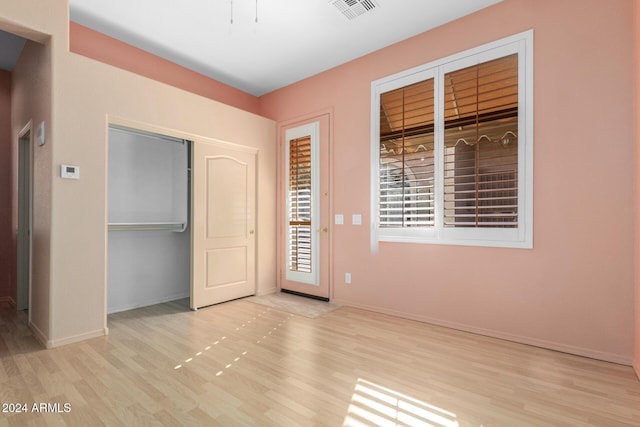 unfurnished room featuring light wood-type flooring