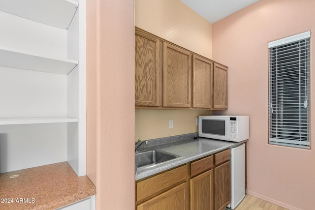 kitchen with white appliances and sink