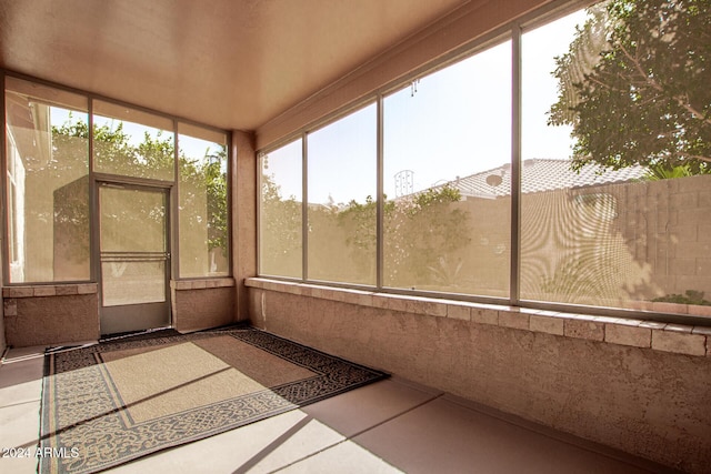 unfurnished sunroom featuring a healthy amount of sunlight