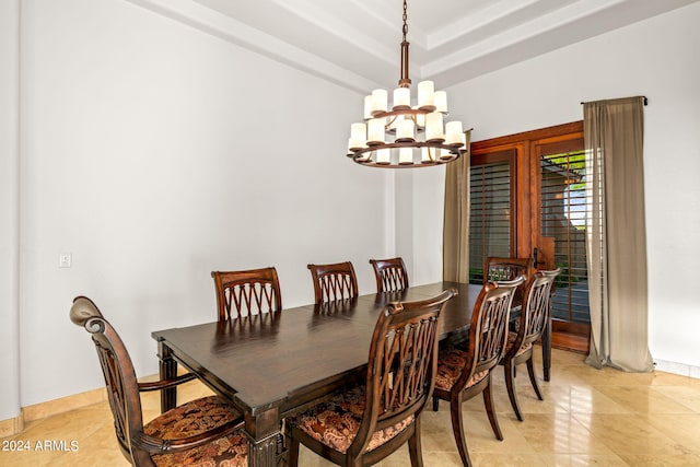 tiled dining space featuring an inviting chandelier