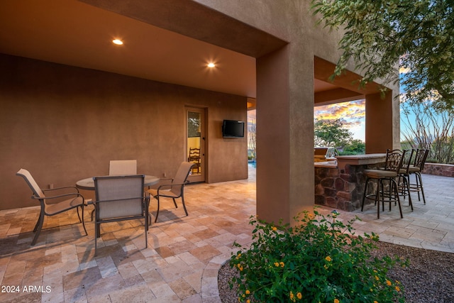 view of patio / terrace with exterior bar and exterior kitchen