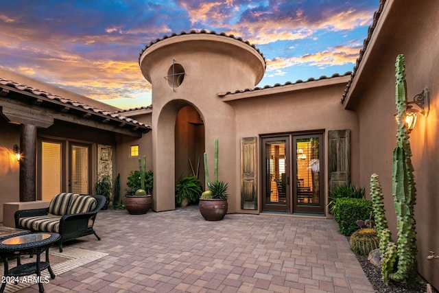 patio terrace at dusk with french doors