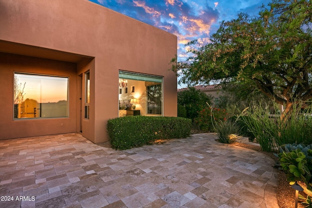 view of patio terrace at dusk