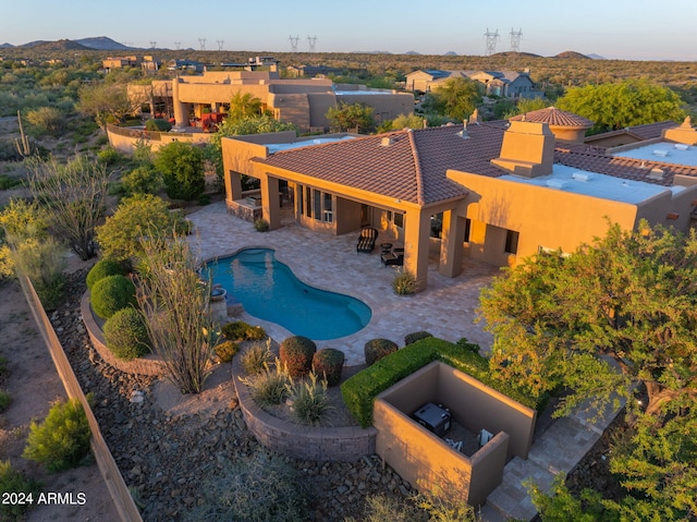 view of pool featuring a patio