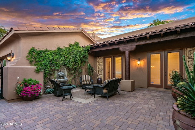 view of patio terrace at dusk