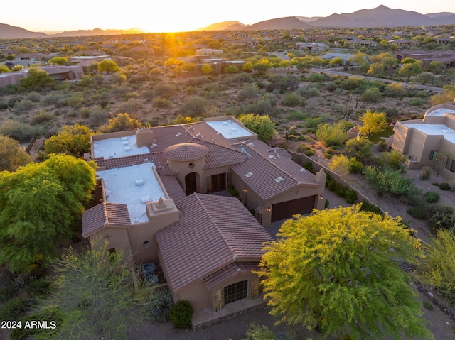 aerial view at dusk with a mountain view