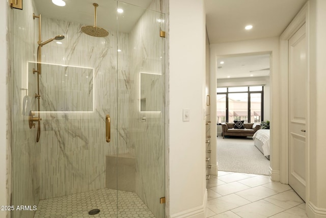 ensuite bathroom featuring a marble finish shower, connected bathroom, and recessed lighting