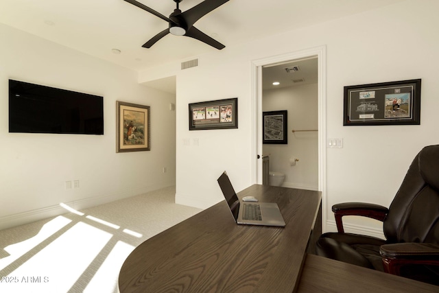 carpeted office featuring baseboards, visible vents, and a ceiling fan