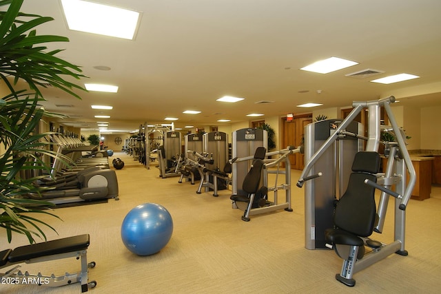 exercise room with carpet floors and visible vents