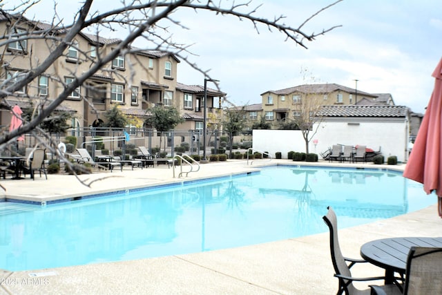 view of pool featuring a patio