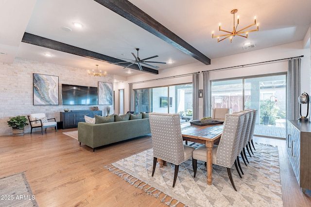 dining room featuring light wood-style floors, visible vents, a chandelier, and beamed ceiling