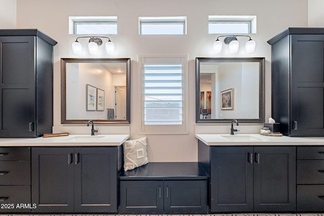 bathroom with two vanities and a sink