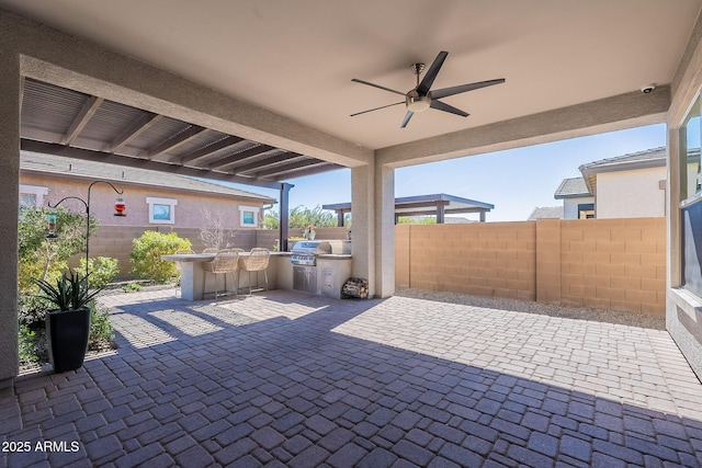 view of patio / terrace featuring fence, area for grilling, and ceiling fan