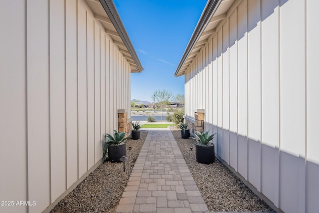 view of home's exterior with board and batten siding and a water view