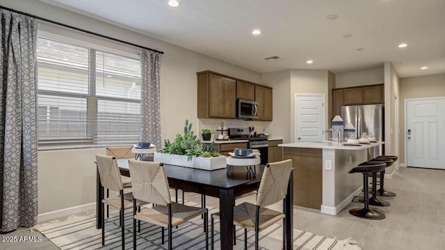 24066 W Cocopah St, Buckeye, AZ 85326 - dining space featuring recessed lighting, light wood-type flooring, and baseboards