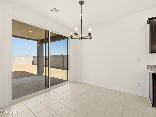 unfurnished dining area with light tile patterned floors and a chandelier