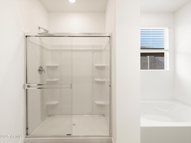 bathroom featuring plus walk in shower