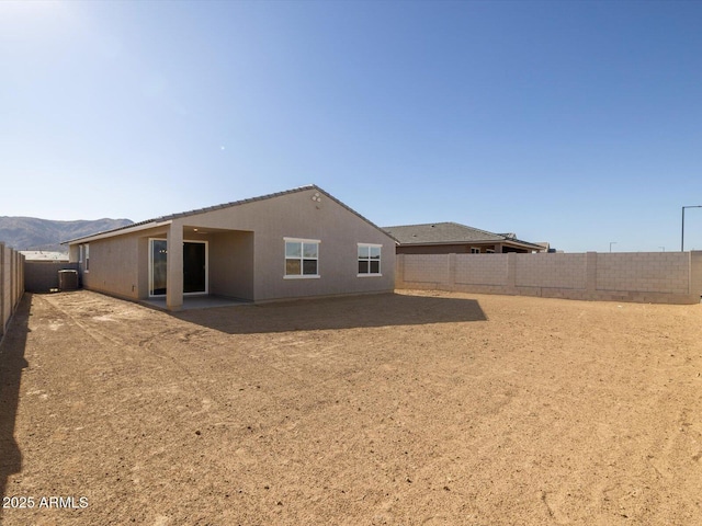 back of property with a mountain view