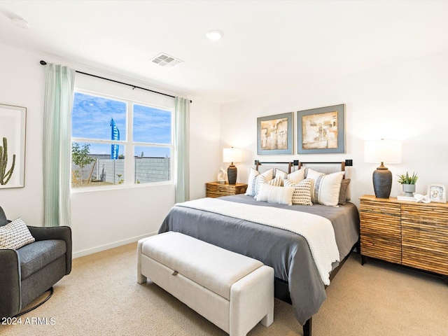 bedroom featuring light carpet