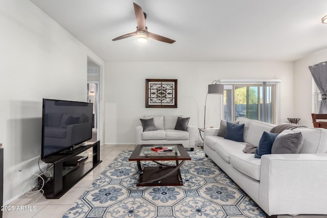 living room featuring ceiling fan and light tile patterned floors