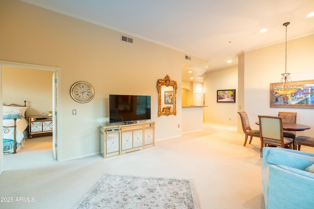 living room featuring crown molding, visible vents, and carpet flooring