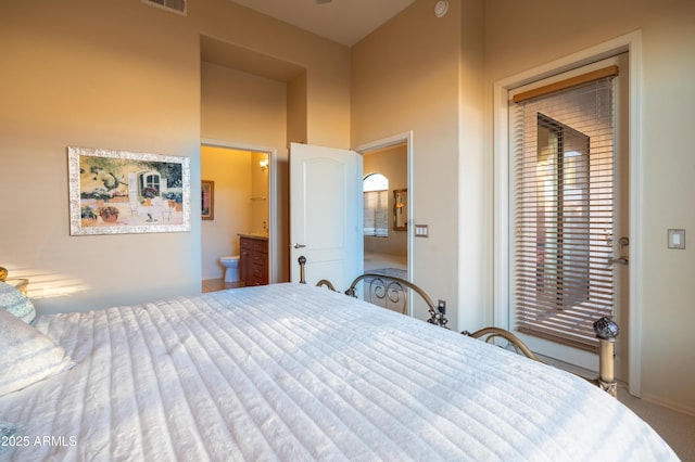 bedroom featuring access to exterior, carpet, visible vents, and connected bathroom