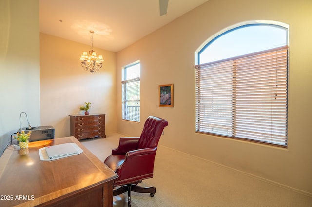 carpeted home office with baseboards and an inviting chandelier